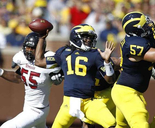 Denard Robinson (16) and Elliott Mealer (57)