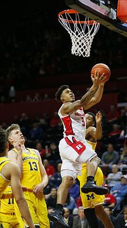D.J. Wilson (5), Moritz Wagner (13), and Zak Irvin (21)