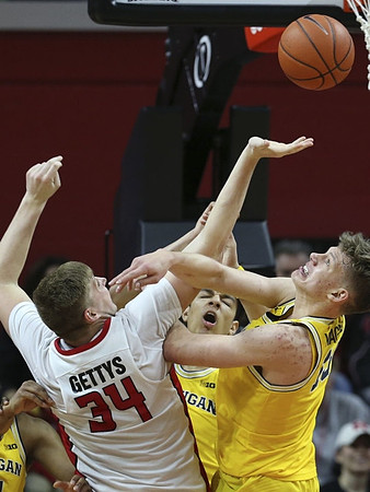 D.J. Wilson (5) and Moritz Wagner (13)
