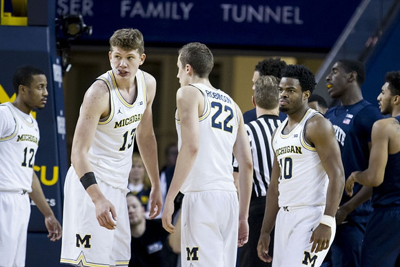 Muhammad-Ali Abdur-Rahkman (12), Moritz Wagner (13), Duncan Robinson (22), and Derrick Walton Jr. (10)