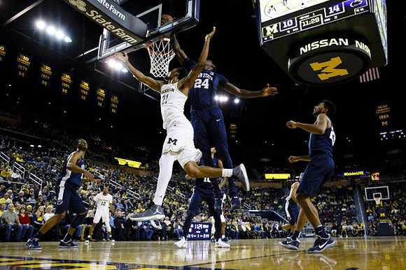 Zak Irvin (21) and Muhammad-Ali Abdur-Rahkman (12)