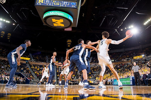 Derrick Walton Jr. (10) and D.J. Wilson (5)