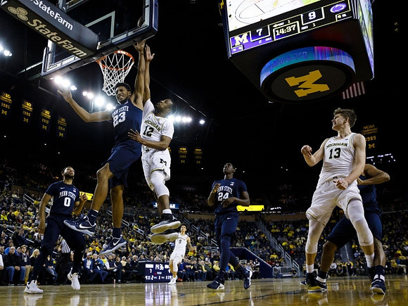 Muhammad-Ali Abdur-Rahkman (12), D.J. Wilson (5), and Moritz Wagner (13)