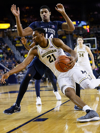 Zak Irvin (21) and Mark Donnal (34)