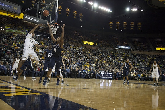 Muhammad-Ali Abdur-Rahkman (12), Derrick Walton Jr. (10), and Zak Irvin (21)