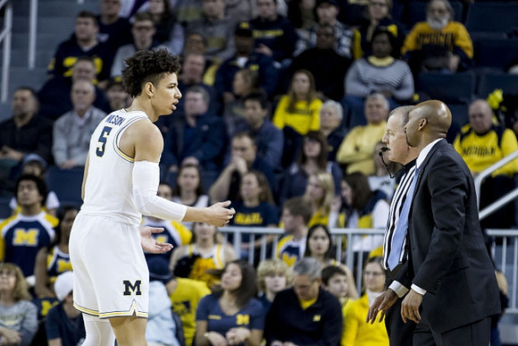 D.J. Wilson (5) and Saddi Washington