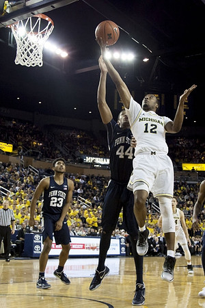 Muhammad-Ali Abdur-Rahkman (12) and Mark Donnal (34)