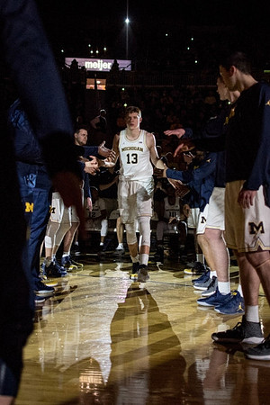 Moritz Wagner (13) and Michigan Team
