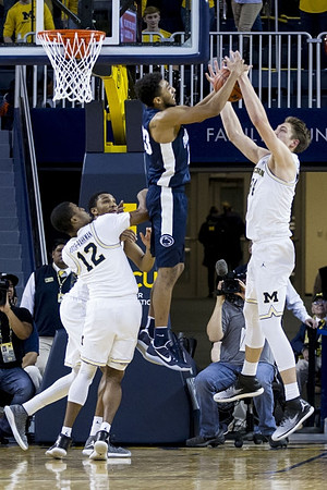 Muhammad-Ali Abdur-Rahkman (12), Zak Irvin (21), and Mark Donnal (34)
