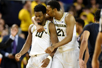 Derrick Walton Jr. (10) and Zak Irvin (21)