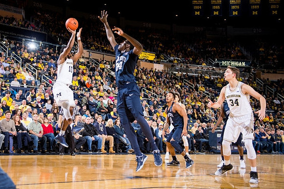 Derrick Walton Jr. (10) and Mark Donnal (34)