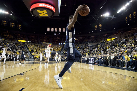 D.J. Wilson (5) and Michigan Team