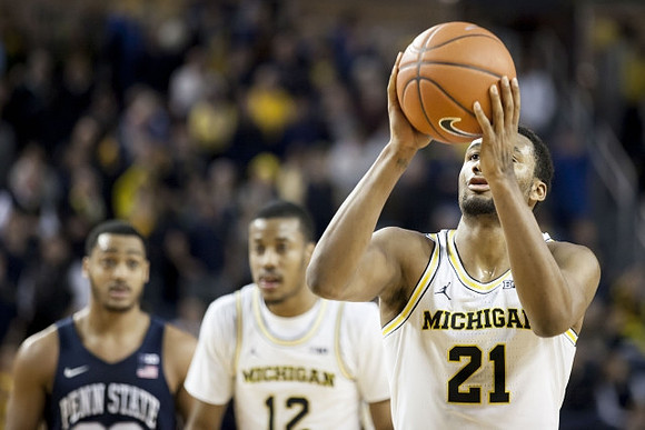Muhammad-Ali Abdur-Rahkman (12) and Zak Irvin (21)