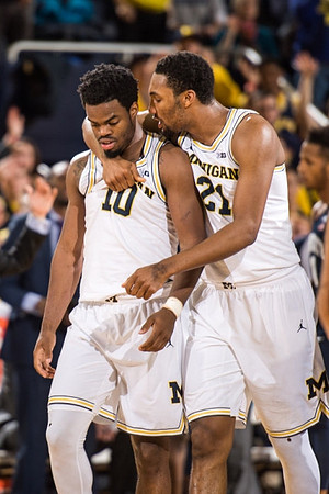 Derrick Walton Jr. (10) and Zak Irvin (21)
