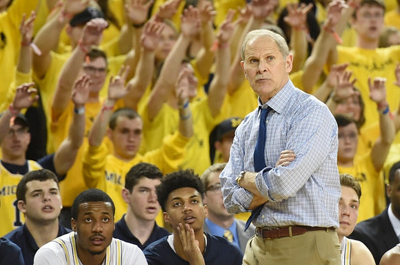 Muhammad-Ali Abdur-Rahkman (12), Ibi Watson (23), and John Beilein