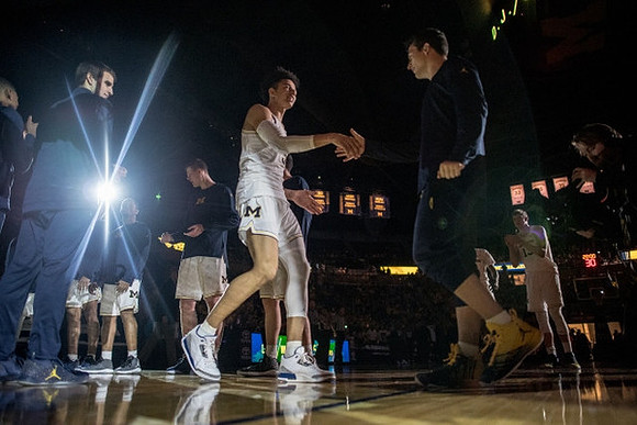 D.J. Wilson (5) and Michigan Team