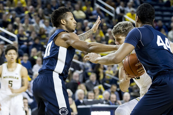 Moritz Wagner (13) and D.J. Wilson (5)