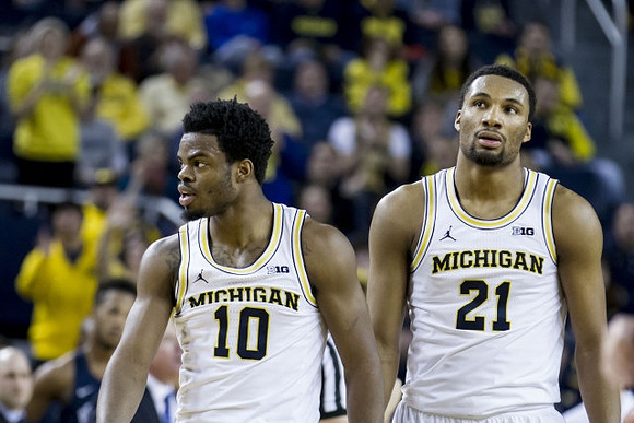 Derrick Walton Jr. (10) and Zak Irvin (21)