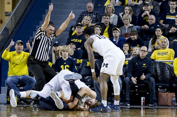 Moritz Wagner (13) and Derrick Walton Jr. (10)