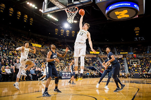 D.J. Wilson (5) and Moritz Wagner (13)