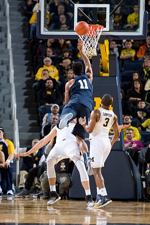 Mark Donnal (34) and Xavier Simpson (3)