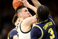 Zavier Simpson (3) and Brandon Johns Jr. (23)
