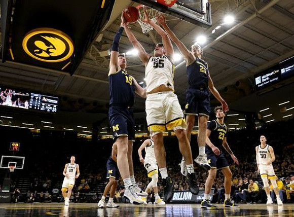 Jon Teske (15), Franz Wagner (21), and Brandon Johns Jr. (23)