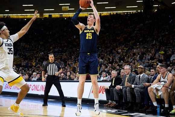 Jon Teske (15) and Iowa Head Coach Fran McCaffery