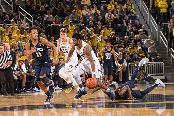 Moritz Wagner (13) and Derrick Walton Jr. (10)