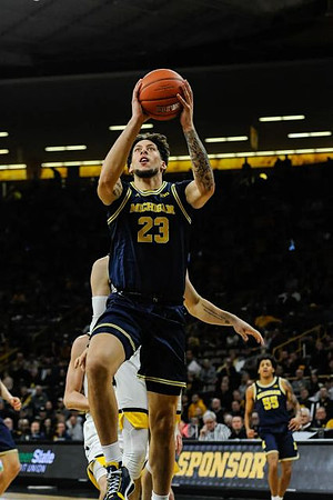 Brandon Johns Jr. (23) and Eli Brooks (55)