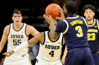 Zavier Simpson (3) and Brandon Johns Jr. (23)