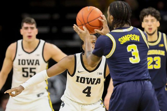 Zavier Simpson (3) and Brandon Johns Jr. (23)