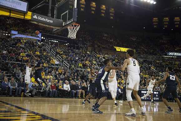 Muhammad-Ali Abdur-Rahkman (12), Moritz Wagner (13), D.J. Wilson (5), and Zak Irvin (21)