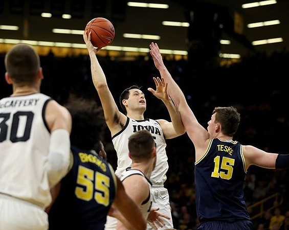 Eli Brooks (55) and Jon Teske (15)