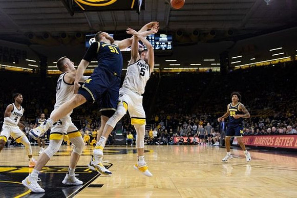 Austin Davis (51) and Iowa Head Coach Fran McCaffery