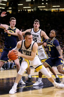 Jon Teske (15) and Zavier Simpson (3)