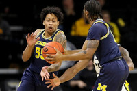 Eli Brooks (55) and Zavier Simpson (3)