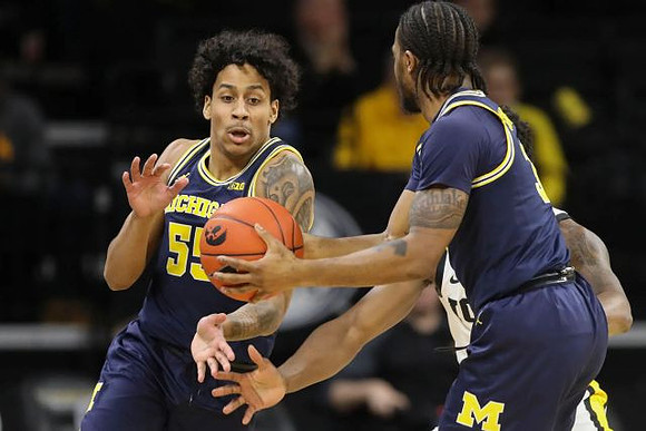 Eli Brooks (55) and Zavier Simpson (3)