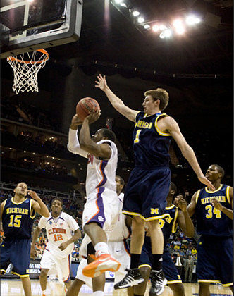 Stu Douglass (1), David Merritt (15), Manny Harris (3), and DeShawn Sims (34)
