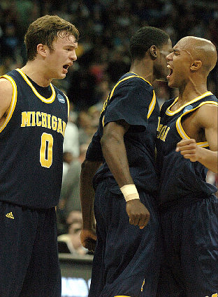 Zack Novak (0), Manny Harris (3), and C.J. Lee (2)