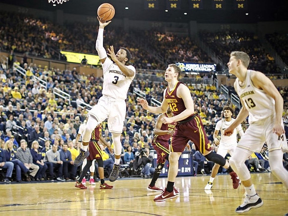 Zavier Simpson (3), Isaiah Livers (4), and Moritz Wagner (13)