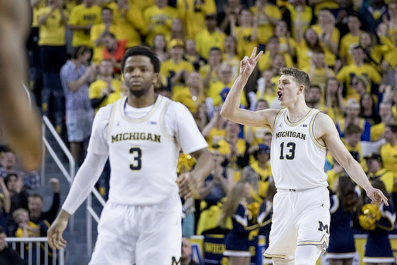 Zavier Simpson (3) and Moritz Wagner (13)