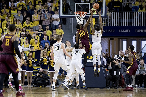 Moritz Wagner (13), Duncan Robinson (22), Zavier Simpson (3), and Charles Matthews (1)