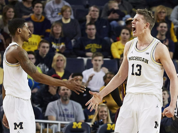 Charles Matthews (1) and Moritz Wagner (13)