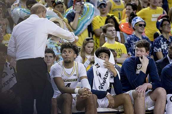 John Beilein, Isaiah Livers (4), Jordan Poole (2), and Jon Teske (15)