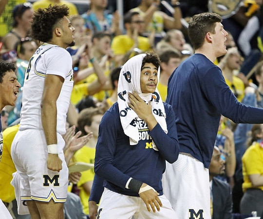 Isaiah Livers (4), Jordan Poole (2), and Jon Teske (15)