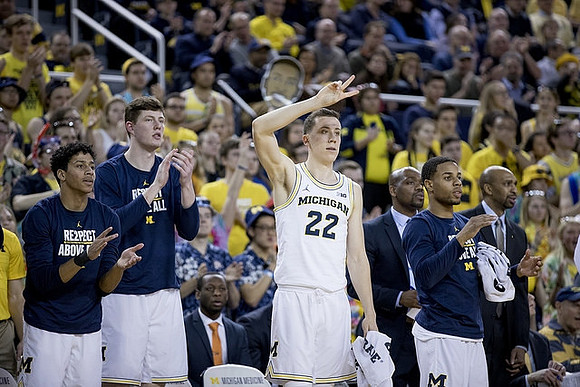 Eli Brooks (55), Jon Teske (15), Duncan Robinson (22), Deandre Haynes, Jaaron Simmons (5), and Saddi Washington