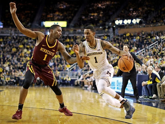 Charles Matthews (1) and Minnesota Head Coach Richard Pitino