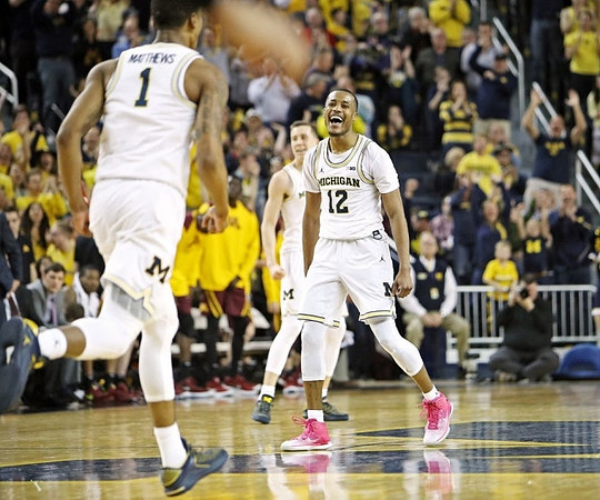 Charles Matthews (1), Duncan Robinson (22), and Muhammad-Ali Abdur-Rahkman (12)