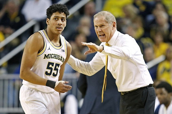 Eli Brooks (55) and John Beilein